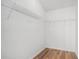 Walk-in closet with shelving system and wood floor at 2794 Hillvale Cove Way, Lithonia, GA 30058