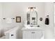 Elegant half bathroom featuring modern vanity, fixtures, decor, and neutral color palette at 3185 Perch Sw Dr, Marietta, GA 30008