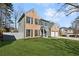 Attractive two-story home with a combination brick and siding exterior, complimented by a lush green lawn at 3185 Perch Sw Dr, Marietta, GA 30008