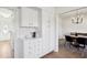 Bright kitchen with white cabinets and subway tile backsplash open to formal dining area at 3185 Perch Sw Dr, Marietta, GA 30008