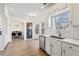 Lovely kitchen showcasing white cabinetry, stainless steel appliances, and open to dining area at 3185 Perch Sw Dr, Marietta, GA 30008