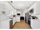 Bright kitchen with stainless steel appliances, white cabinets, and modern countertops at 3185 Perch Sw Dr, Marietta, GA 30008