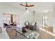 Bright living room featuring hardwood floors, natural light, and views into the dining area and staircase at 3185 Perch Sw Dr, Marietta, GA 30008