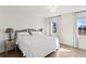 Bright main bedroom featuring hardwood floors, natural light, and neutral paint palette at 3185 Perch Sw Dr, Marietta, GA 30008