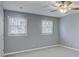 Bedroom with light gray walls and natural light at 1615 Arden Sw Dr, Marietta, GA 30008