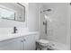 Modern bathroom with a glass shower, white marble tile, and stylish fixtures at 2010 Smith Nw Dr, Kennesaw, GA 30144