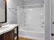 Well-lit bathroom features a shower-tub combo and ample space at 1649 Southgate Mill Dr, Duluth, GA 30096