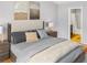 Comfortable bedroom featuring stylish decor and a doorway leading to an adjoining bathroom at 1649 Southgate Mill Dr, Duluth, GA 30096