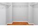 Walk-in closet with shelving and hardwood floors at 1649 Southgate Mill Dr, Duluth, GA 30096