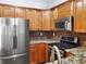 Well-equipped kitchen features stainless steel appliances and granite countertops at 1649 Southgate Mill Dr, Duluth, GA 30096
