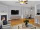 Comfortable living space with a fireplace, hardwood floors, and stylish furniture at 1649 Southgate Mill Dr, Duluth, GA 30096