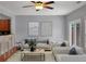 Stylish living area featuring hardwood floors, a fireplace, and neutral-toned furnishings at 1649 Southgate Mill Dr, Duluth, GA 30096
