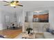 Cozy living room with bar seating area, dining space, hardwood floors and natural light at 1649 Southgate Mill Dr, Duluth, GA 30096