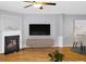Bright living room with fireplace, hardwood floors, and modern decor at 1649 Southgate Mill Dr, Duluth, GA 30096