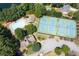Aerial view of community pool, tennis courts, and manicured landscaping offers residents an active lifestyle at 1850 Kirkmont Nw Dr, Marietta, GA 30064