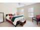 Well-lit bedroom with neutral walls, carpet, queen bed, and two windows at 1850 Kirkmont Nw Dr, Marietta, GA 30064