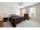 Bedroom with neutral paint, carpet, dresser and window with natural light at 1850 Kirkmont Nw Dr, Marietta, GA 30064