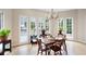 Dining area offers natural light and views of the pool and backyard at 1850 Kirkmont Nw Dr, Marietta, GA 30064