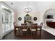 Elegant dining room featuring a large window, chandelier, and hardwood floors at 1850 Kirkmont Nw Dr, Marietta, GA 30064