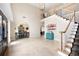 Open foyer with staircase, tile flooring, and views of the dining room at 1850 Kirkmont Nw Dr, Marietta, GA 30064