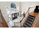 Upstairs view of the foyer with a staircase, large windows, and iron double doors at 1850 Kirkmont Nw Dr, Marietta, GA 30064