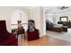 Hallway with hardwood floors, sitting area, and an open view into the main bedroom at 1850 Kirkmont Nw Dr, Marietta, GA 30064