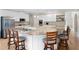 Spacious kitchen features granite countertops, stainless steel appliances, white cabinets, and a breakfast bar at 1850 Kirkmont Nw Dr, Marietta, GA 30064