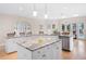 Bright kitchen with a granite island, stainless steel appliances, lots of natural light, and hardwood floors at 1850 Kirkmont Nw Dr, Marietta, GA 30064