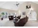 Inviting living room with French doors, fireplace, and high vaulted ceiling at 1850 Kirkmont Nw Dr, Marietta, GA 30064
