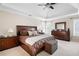 Spacious main bedroom featuring tray ceiling, neutral decor, and natural light at 1850 Kirkmont Nw Dr, Marietta, GA 30064