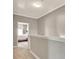 Upstairs hallway with carpet and neutral paint leading into bedroom at 1901 Sterling Oaks Cir, Atlanta, GA 30319