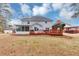 Home exterior showcasing sunroom, deck and backyard, great for outdoor enjoyment and relaxation at 5705 Mountain Cres, Stone Mountain, GA 30087
