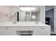 Bathroom featuring a white double-sink vanity, tub, and shower, and mirror at 5705 Mountain Cres, Stone Mountain, GA 30087