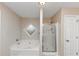 Bathroom featuring a soaking tub and glass shower stall at 5705 Mountain Cres, Stone Mountain, GA 30087