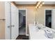 Bathroom featuring a white vanity with a large mirror and view to additional room at 5705 Mountain Cres, Stone Mountain, GA 30087