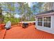 Large wooden deck with railing features ample space, perfect for barbecues and outdoor gatherings at 5705 Mountain Cres, Stone Mountain, GA 30087