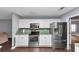 Kitchen features stainless steel appliances, ample white cabinetry, and a stainless steel refrigerator at 5705 Mountain Cres, Stone Mountain, GA 30087