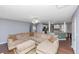 Spacious living room with a sectional sofa and an open view to the kitchen and dining area at 5705 Mountain Cres, Stone Mountain, GA 30087