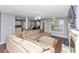 Open-concept living area with a sectional sofa, fireplace, and view of the kitchen and dining area at 5705 Mountain Cres, Stone Mountain, GA 30087