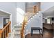 Elegant staircase with wooden banisters, carpeted steps, and a welcoming message on the wall at 5705 Mountain Cres, Stone Mountain, GA 30087