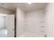 Bathroom featuring a separate tub with built-in shelving and a glass door at 1010 Nandina Ct, Villa Rica, GA 30180