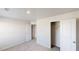This bedroom features neutral carpet and walls with a closet and an additional doorway at 1010 Nandina Ct, Villa Rica, GA 30180