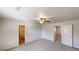 Spacious bedroom with neutral walls and plush carpeting and ceiling fan at 1010 Nandina Ct, Villa Rica, GA 30180