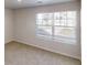 Bedroom with plush carpet and natural light streaming through large window at 1010 Nandina Ct, Villa Rica, GA 30180