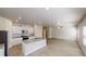 Open concept floorplan featuring a granite island with a sink, white cabinets and stainless steel appliances at 1010 Nandina Ct, Villa Rica, GA 30180