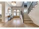 Inviting foyer with hardwood floors, staircase, and decorative wreath on the front door at 109 Daxton Dr, Canton, GA 30115