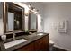 Bathroom boasts a double sink vanity, updated lighting, and decorative mirrors at 955 Juniper Ne St # 4229, Atlanta, GA 30309