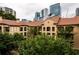 Exterior of the Tuscany Condominiums featuring multiple stories, balconies, and terracotta roofing at 955 Juniper Ne St # 4229, Atlanta, GA 30309