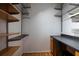 Spacious walk-in closet with custom shelving and a built in desk and vanity at 955 Juniper Ne St # 4229, Atlanta, GA 30309