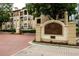 A beautiful entrance to the Tuscany Condominiums with paved brick, lush landscaping, and manicured gardens at 955 Juniper Ne St # 4229, Atlanta, GA 30309